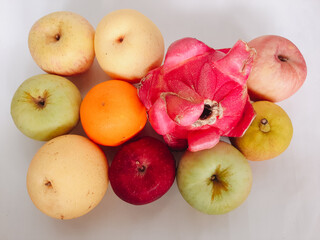 Assorted tropical fruits on white background