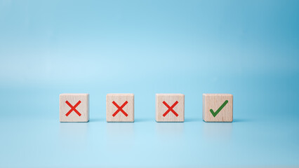 Checkbox with green check mark from row of multiple boxes with red crosses on blue background, Pro...