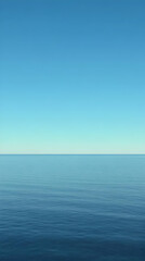 Obraz premium Tranquil Ocean Meets Clear Blue Sky on a Calm Day, Minimalist Seascape Photography
