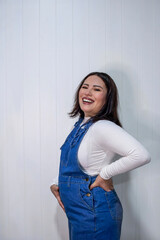 Portrait Smiling pregnant woman against white background 