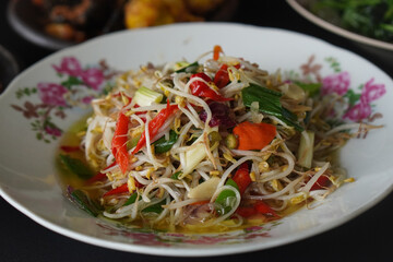 Flavorful Indonesian cuisine rich in spices, captured on February 6, 2025. The vibrant colors and aromatic ingredients create a delicious and authentic culinary scene