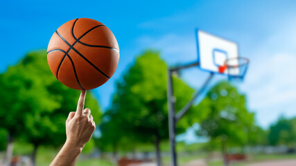 Basket ball spinning on a finger