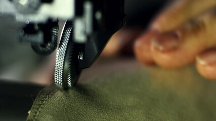 4k aerial video of hand sewing leather shoes process in a workshop by skilled artisans using traditional techniques