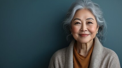 Fototapeta premium Elegant Senior Asian Woman Portrait - Happy Mature Lady in Blue