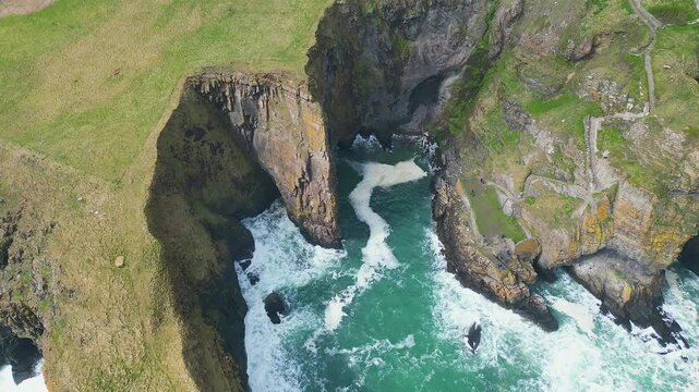 Aerial footage of the Elephant Cliff and Whaligoe Steps in Whaligoe town in Caithness, Scotland, UK