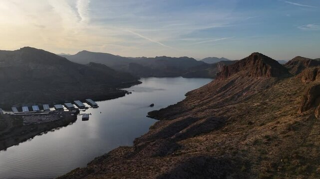 Drone View of Canyon Lake on the Apache Trail in Arizona. Late evening with cruise boat on the water with High rising mountains