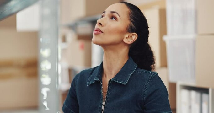 Loader, logistics and woman with boxes, shelf and organizing of goods in warehouse, serious and cargo. Shipping, employee and production for supply chain in factory, supervisor and storage for stock