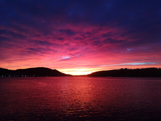Fototapeta premium The sun rising over Dunedin, Otago region, New Zealand