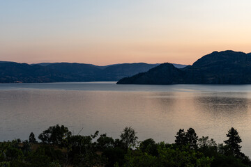 beautiful sunrise scene over a tranquil Okanagan lake British Columbia Canada
