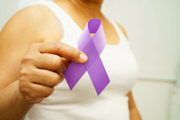 Asian woman with purple ribbon for September World pancreatic cancer day or world Alzheimer day.