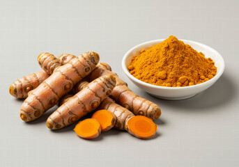 Aromatic Ground Turmeric with Whole Turmeric Roots Highlighting Its Rich Golden Hue and Herbal Benefits