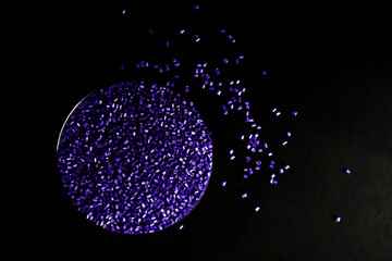 Purple pearl masterbatch granules, isolated on black background, color pigment carrier polymer in...
