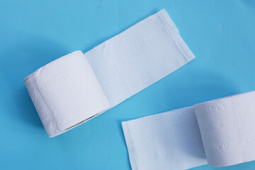 Toilet paper on blue background.