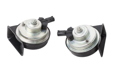 Pair of electric black plastic horns in retro style - car horn on white isolated background in photo studio. Spare part for sale or repair in a workshop, or tuning a buzzer sound in car service.