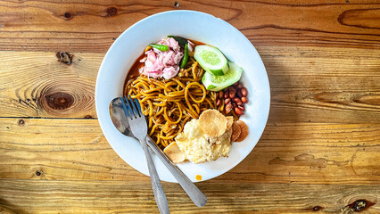 Aceh noodles are a traditional food originating from Aceh.  The beef noodles are served with...