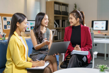 Professional Women Collaborating in Modern Office Setting