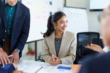 Asian businesspeople discussing and working together during a meeting