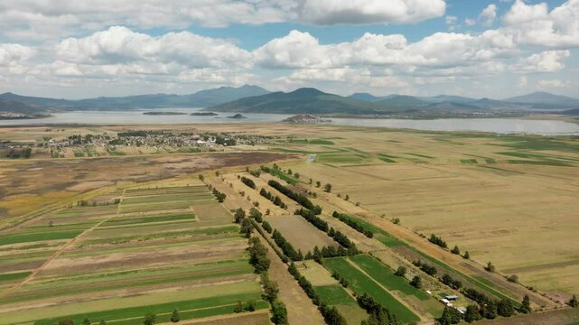 DRONE: DOLLY IN SHOT OF PATZCUARO LAKE WITH CLOUDS