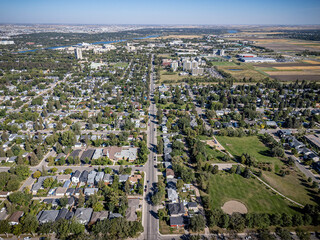 Fototapeta premium City street with houses and a park
