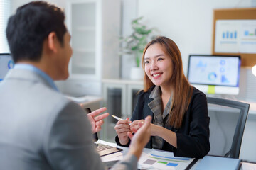 Asian businesspeople discussing and working together during a meeting in office