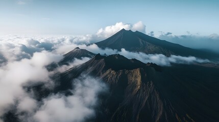 Majestic mountain landscape with fog, serene peaks rising above clouds, perfect for nature-themed designs or travel inspiration.