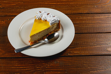 Enjoying fresh homemade orange cheesecake paired with aromatic coffee delight