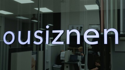 Obraz premium Modern Office Building Exterior with Illuminated 