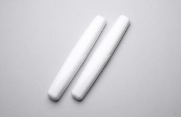 Plastic cases for toothbrushes on gray background