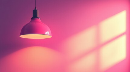 Pink lamp hanging from a ceiling in a modern interior design setting with soft lighting