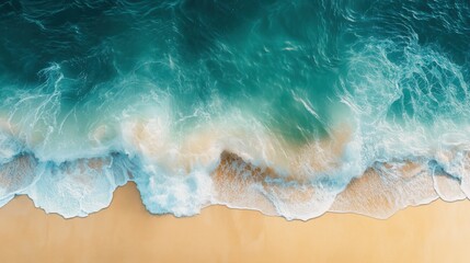 Obraz premium Aerial view of turquoise ocean waves meeting golden sandy beach