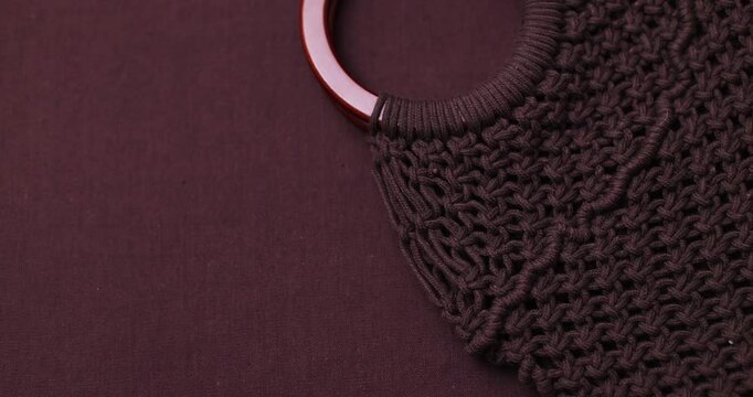 brown macrame bag on brown background, suitable for banners and advertising of macrame and boho crafts
