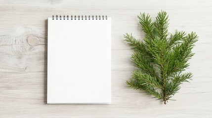 Blank notepad, pine branch, wooden desk; planning