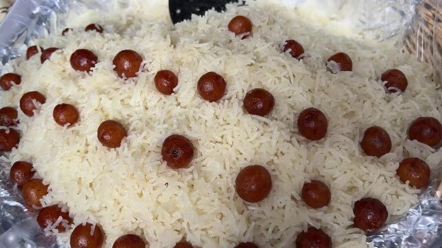 Kolkata style Sitabhog with small Gulab jamuns on top.