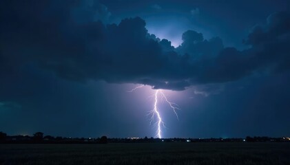 Naklejka premium Dark stormy night with lightning illuminating the dark sky, darkness, atmospheric