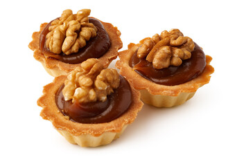 Delicious walnut tartlets with caramel filling showcased on a clean surface