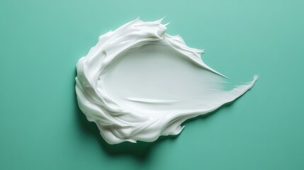 White cosmetic cream texture, skincare lotion swatch on green. Face creme, body moisturiser, hair conditioner smear smudge stroke on color background. Creamy beauty product closeup