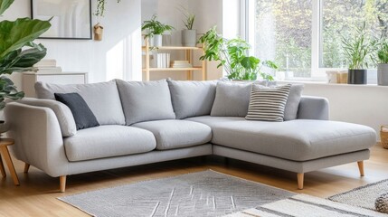 Fototapeta premium Modern Grey Sectional Sofa in Bright Living Room