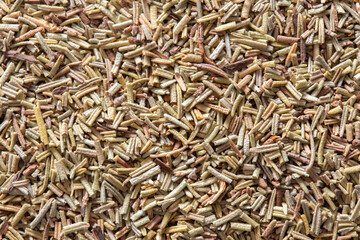 Close-up of dried rosemary cooking herb background. Dried herb food concept.