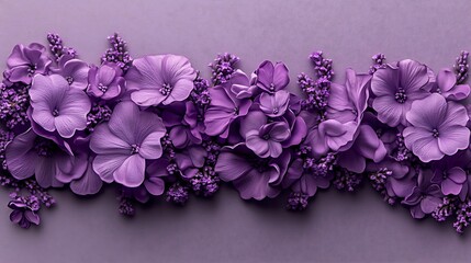 Fototapeta premium A vibrant arrangement of purple flowers against a soft lavender background, showcasing nature's beauty