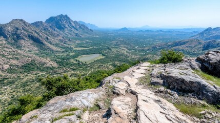 Fototapeta premium Mountaintop path overlooking valley, rural landscape