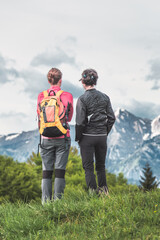 Couple of women friendly women observe the mountains