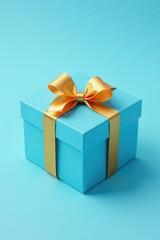 Obraz premium Decorative blue box with gold ribbon and bow on a light blue background, packaging, decorative box, gift box