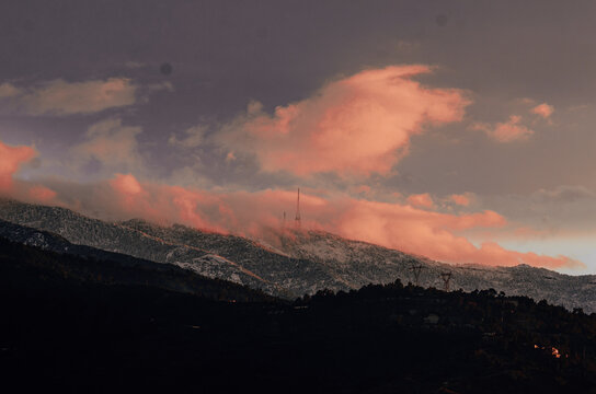 blue hour over a snowy mountain 