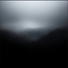 Naklejka premium Black and white photo of a foggy mountain landscape with a zen atmosphere and subtle gradients
