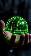 A hand holding a holographic green construction helmet representation, symbolizing safety and innovation.