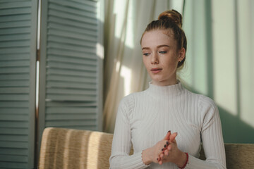 A Thoughtful and Contemplative Young Woman Bathed in Soft, Beautiful Natural Light