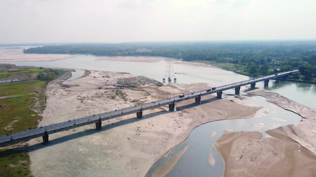 Aerial view of highway road bridge over dry Torsa River near Cooch Behar flows through China, Bhutan, India, and Bangladesh, West Bengal
