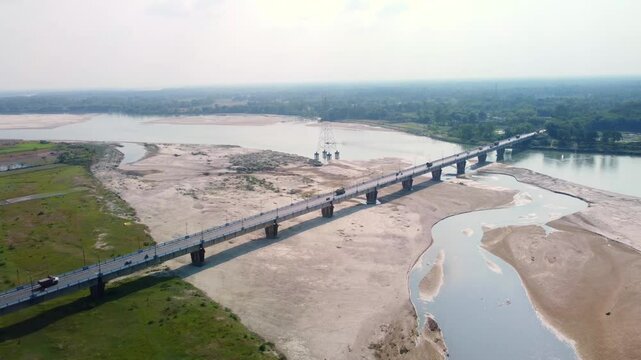 Highway road bridge over dry Torsa River near Cooch Behar in winter flows through China, Bhutan, India, and Bangladesh, West Bengal, Drone view