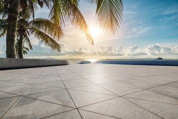 Empty square floor and palm trees with beautiful coastline in summer
