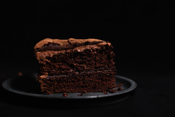 Slice of rich chocolate cake with buttercream